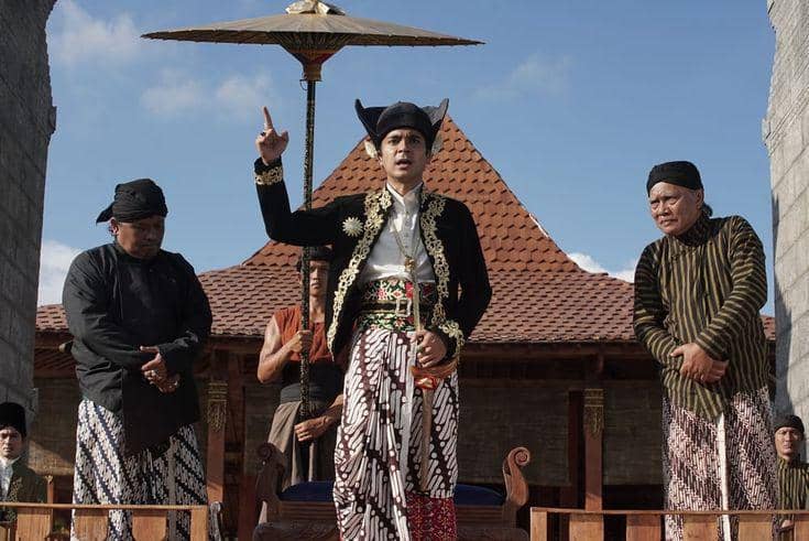 Ilustrasi pria menggunakan pakaian adat Jawa 