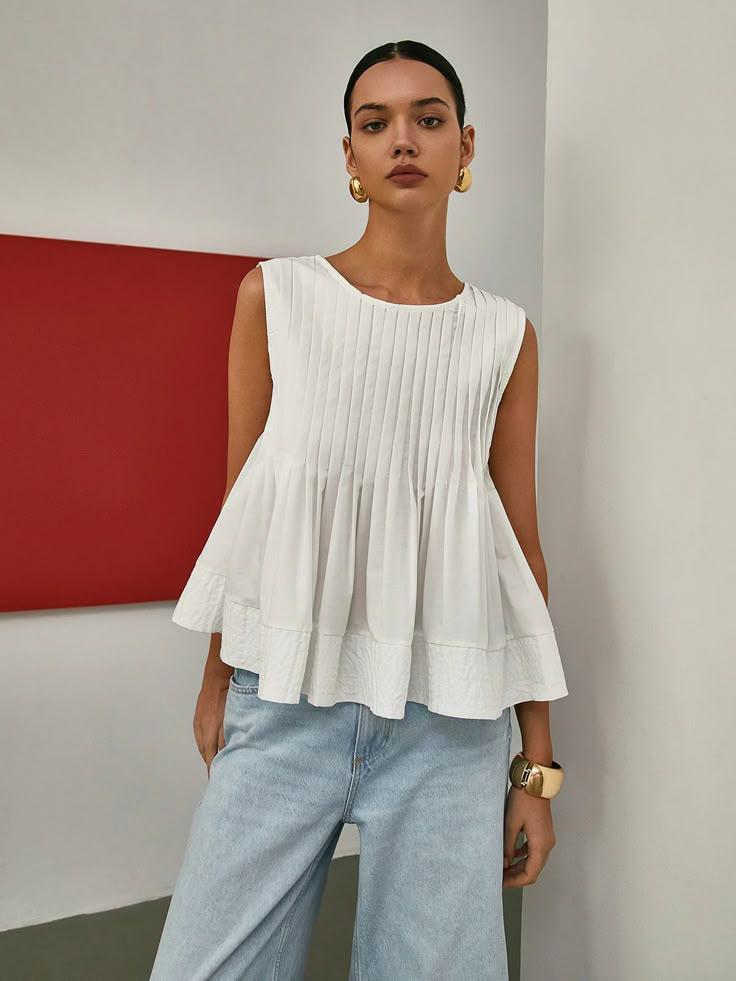 Pleated Peplum Sleeveless Blouse.jpg