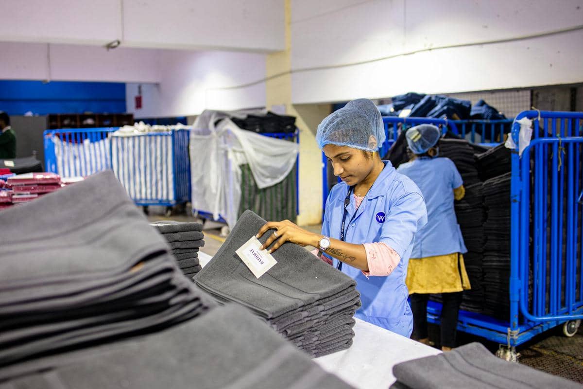 free-photo-of-female-worker-organizing-textiles-in-factory.jpeg