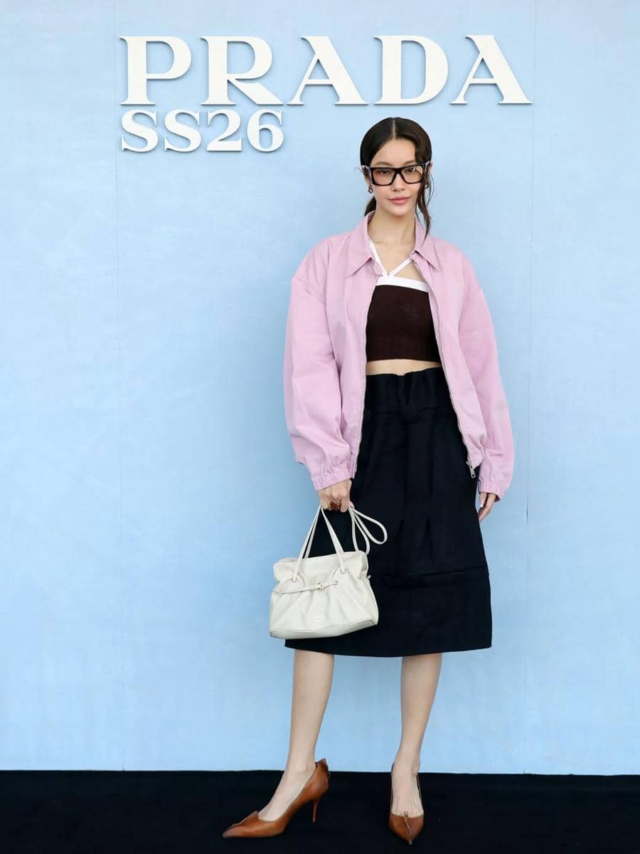 Thai stars @winmetawin, a @prada ambassador and show veteran by now, and @namtan.tipnaree, who made her @prada show debut yesterday at the men’s SS26 reveal, managed to make deep browns look oh so modern, sexy and desirable. 🤎#PradaSS2.jpg