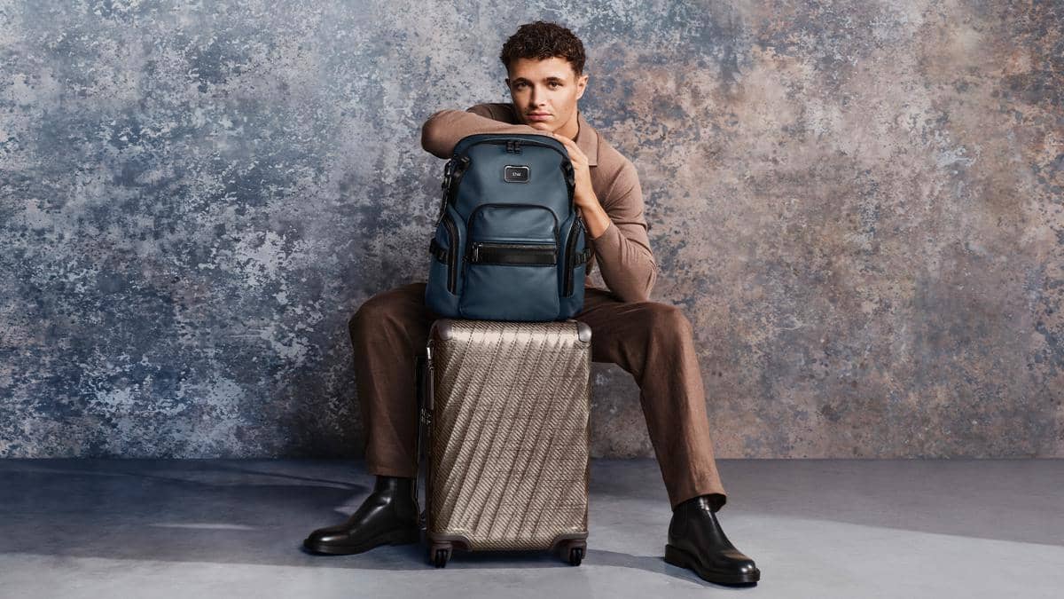 TUMI Icons Tested Campaign_Alpha Bravo Navigation Backpack in Navy Coated Canvas_19 Degree Lite International Carry-On in Titanium Grey.jpg