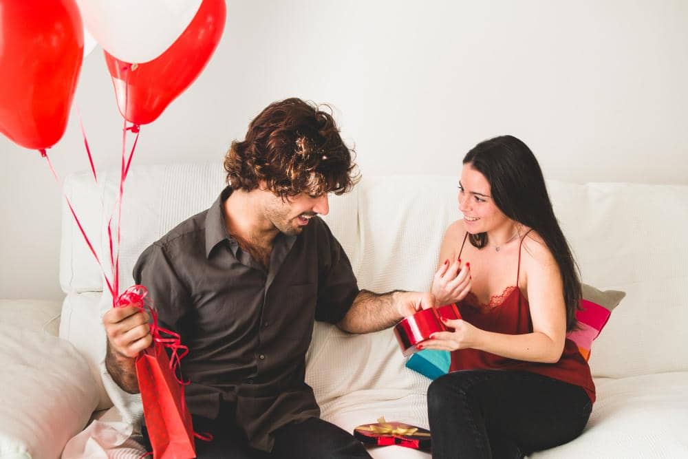 girlfriend-offering-her-boyfriend-candy-from-red-box.jpg