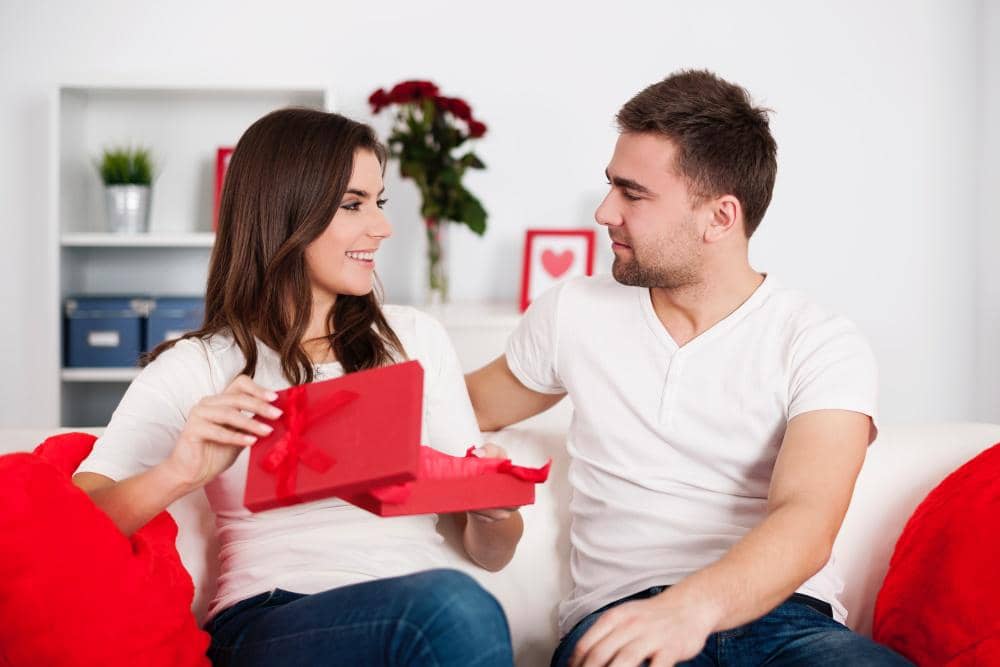 smiling-woman-opening-valentine-s-gift.jpg