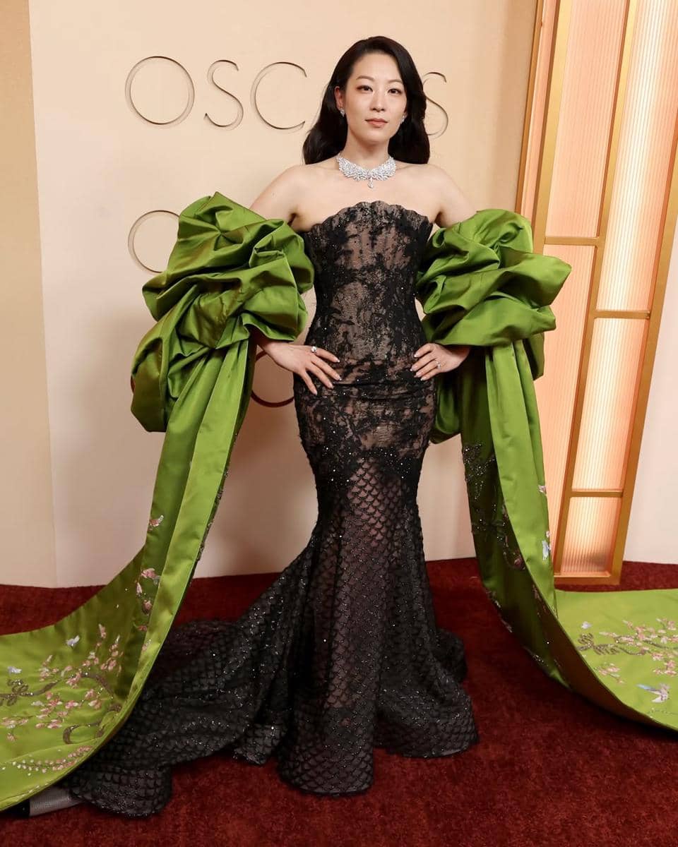 K-pop Demon Hunters Star Arden Cho wears Miss Sohee in a sculpted fishtail gown with an olive gr.jpg